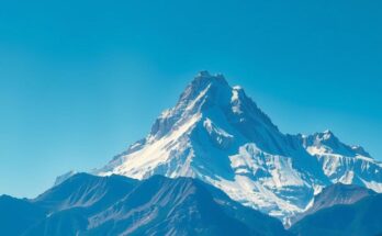 A serene landscape of a mountain peak under a clear blue sky symbolizing focus and goals.