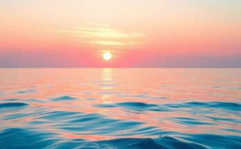 A serene scene with a calm ocean view at sunset, featuring soft light pink hues reflecting on the water.