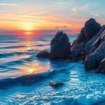 A serene landscape at dusk, featuring soft waves lapping against a rocky shore, reflecting deep blues and purples.