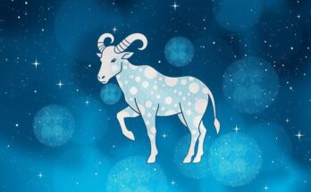 Taurus zodiac symbol surrounded by stars and constellations in a soothing blue and silver colour scheme.